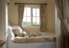 Make your bedroom look bigger like this Farmhouse bedroom by Riverside Shepherd Huts Ltd.