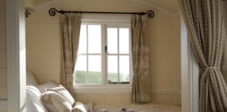 Make your bedroom look bigger like this Farmhouse bedroom by Riverside Shepherd Huts Ltd.