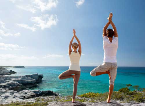 Yoga poses on the beach