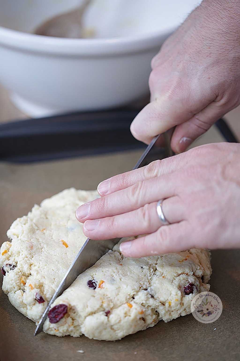 Brian cutting the scones dough in half